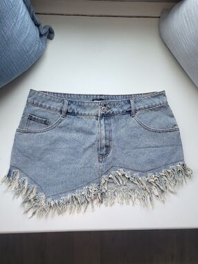 PrettyLittleThing Denim Asymmetric Fringe Mini Skirt